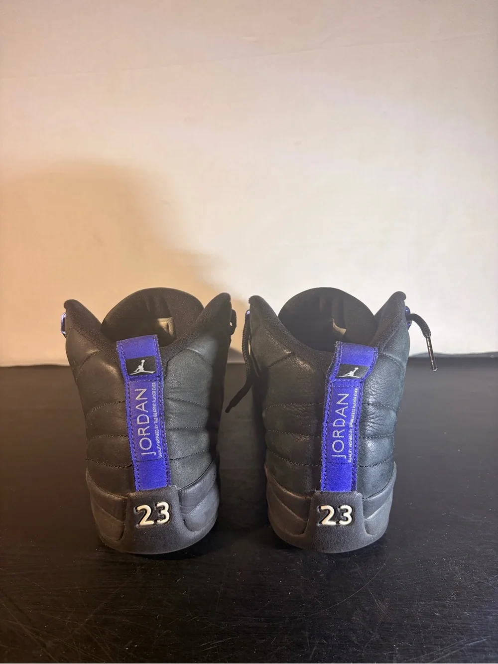 Men's Jordan 11 Black High-Top Athletic Sneakers with Purple Accents